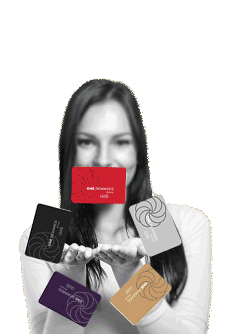 One Rewards cards spinning over a woman's hand